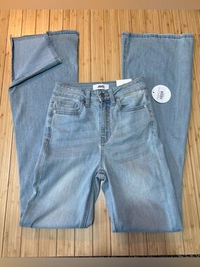 Flare split hem light wash jeans. Size 0/24. NWT.